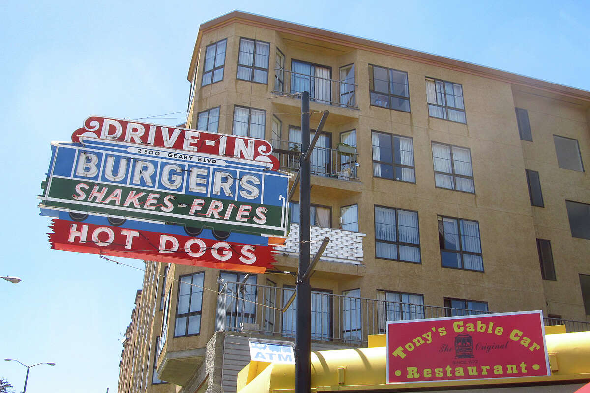 Tony’s neon drive-in sign — Burgers, Shakes-Fries, Hot Dogs — above the restaurant on Geary in 2014